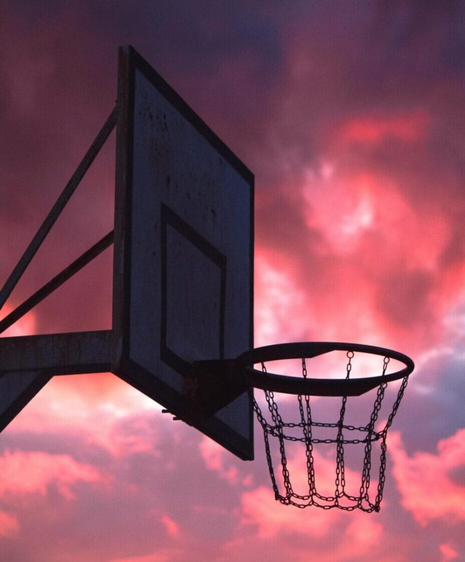 basketball hoop with colorful sky background