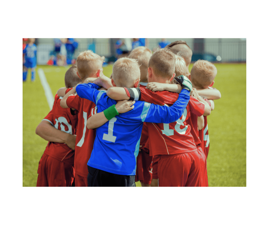 boys soccer team in a huddle