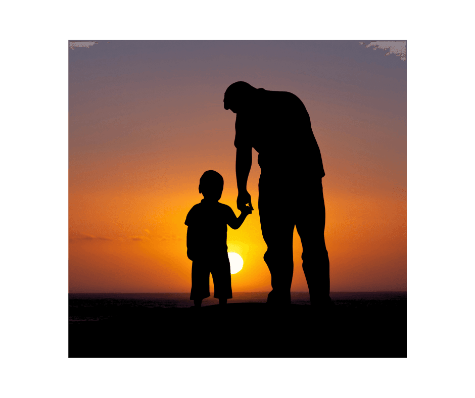 father and son walking into sunset