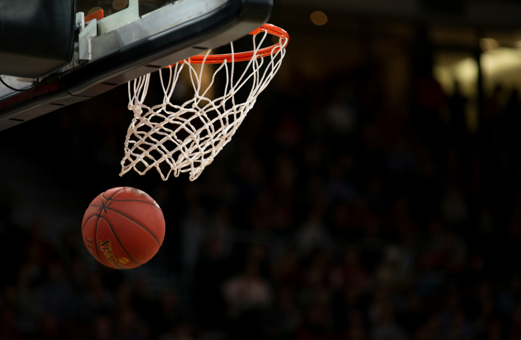 Basketball passing through the hoop