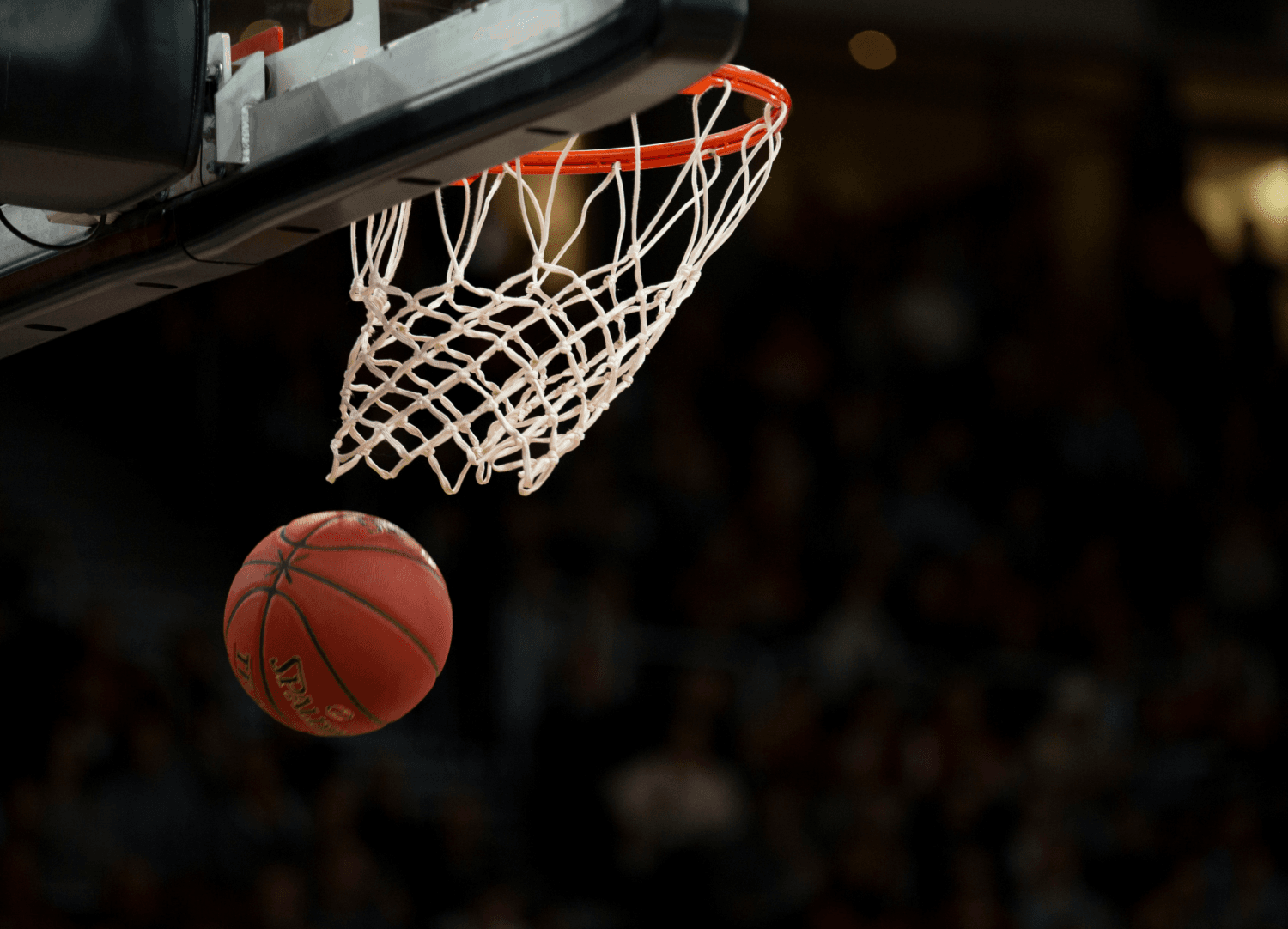 Basketball passing through the hoop