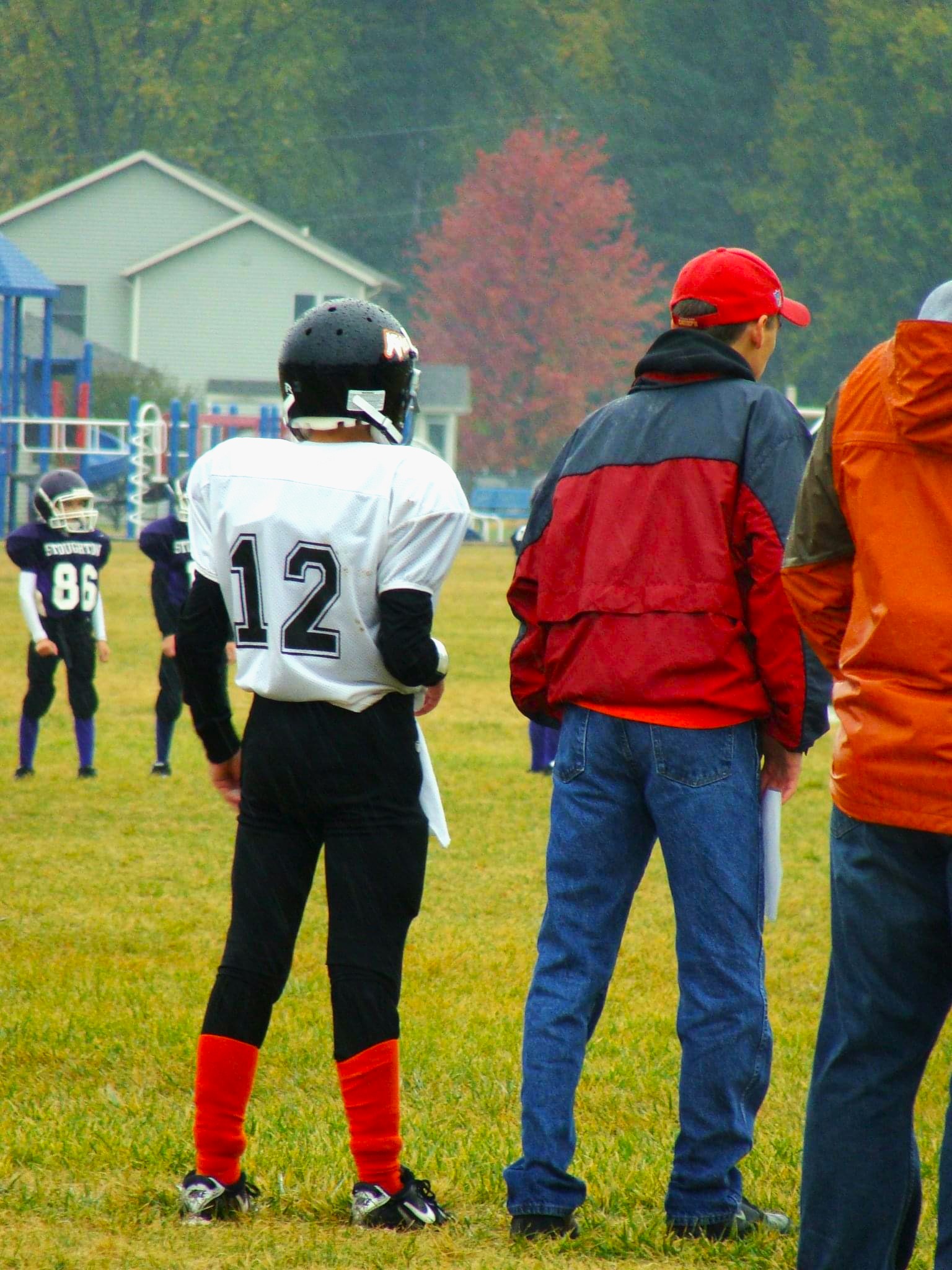 player and coach on sidelines