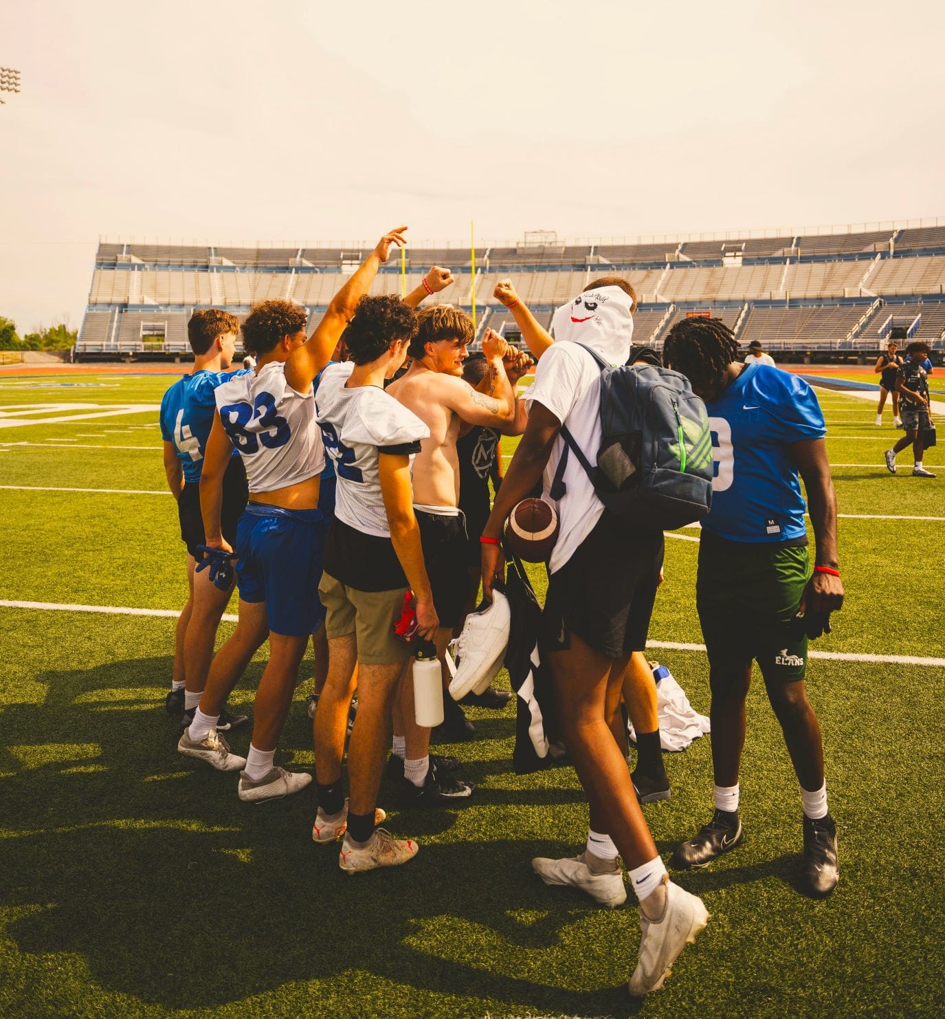 pexels-jean-daniel-13022996 - Ball to Life group of football players in a huddle