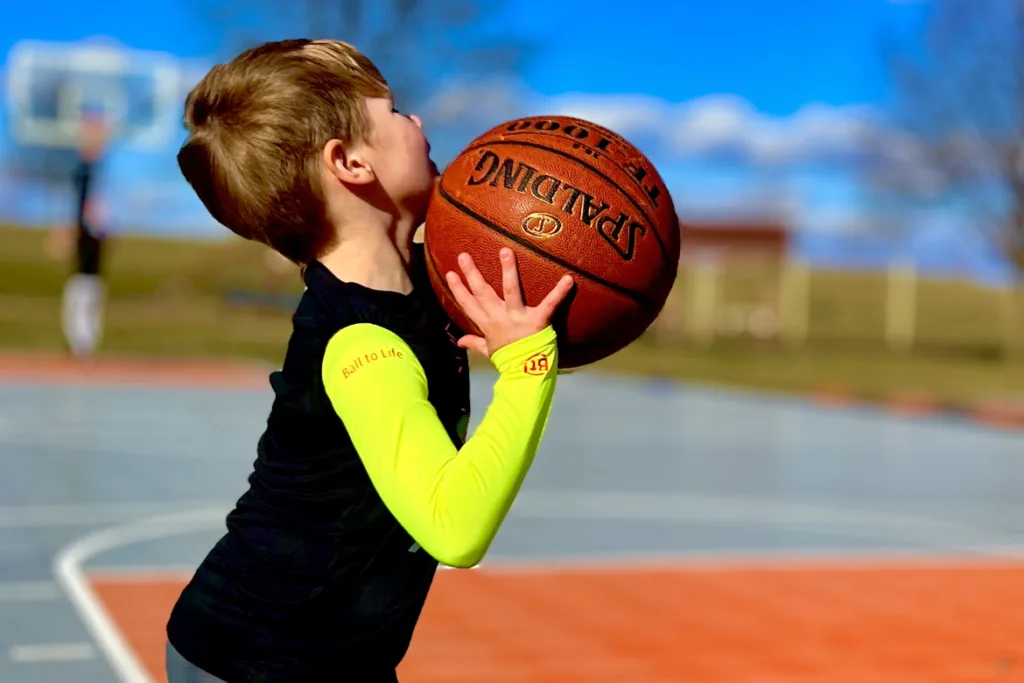 Putting up shots Ball to Life Arm Sleeve - Ball to Life Sports young boy Basketball training BtL Player Development