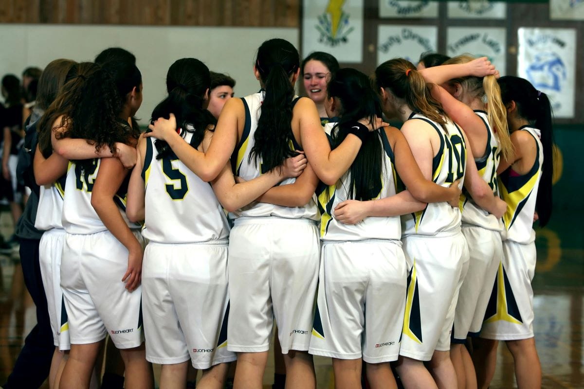 pexels-pixabay-159812 - Ball to Life Sports ladies forming a huddle