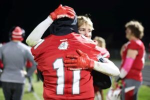 Beyond the play Player spotlight kaden strang hugging teammate after final game