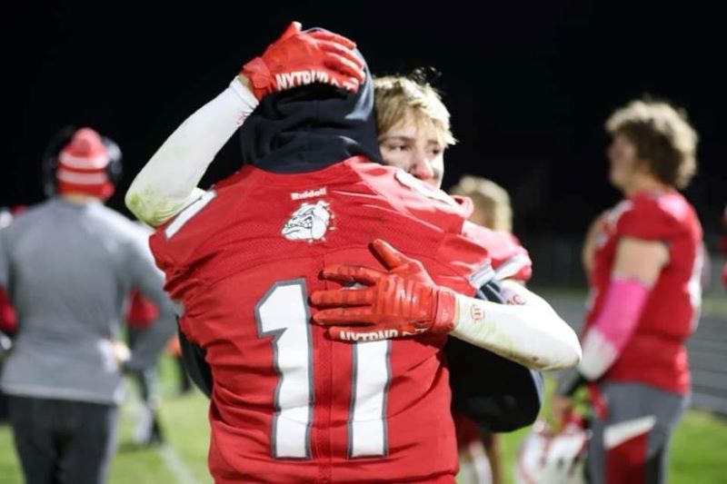 Beyond the play Player spotlight kaden strang hugging teammate after final game