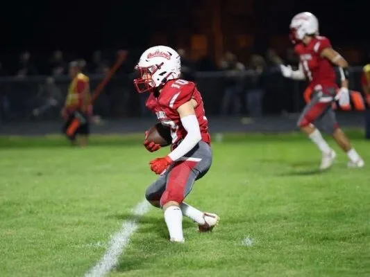 Kaden running with football - Ball to Life Sports football player running with football