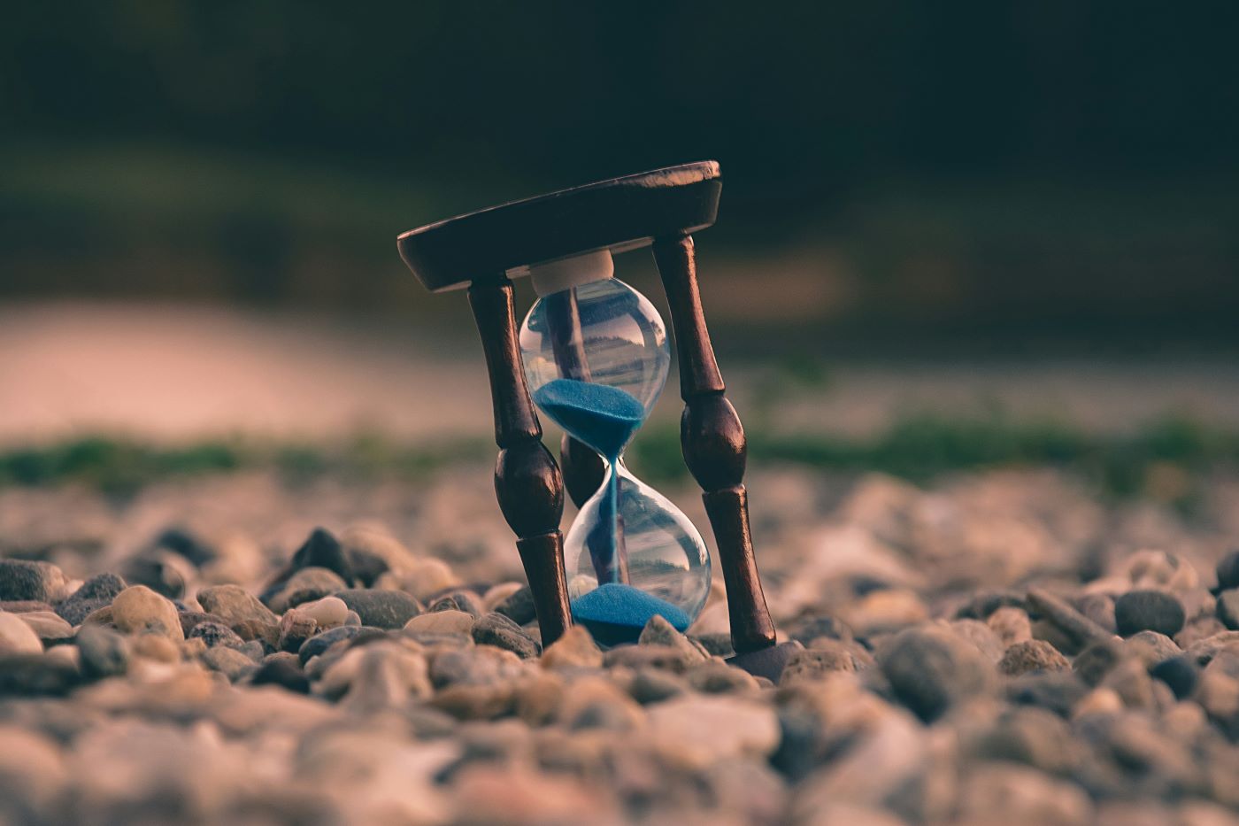 aron-visuals-BXOXnQ26B7o-unsplash - Ball to Life hourglass on stones as reminder to manage your time wisely