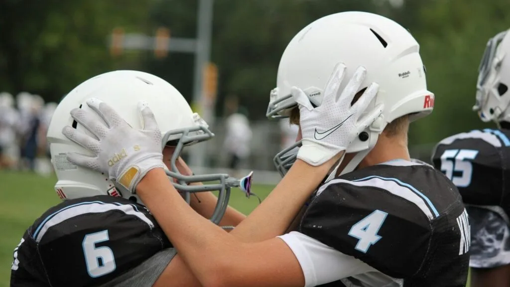 pexels-tracy-elford-96285466-9459399 - Ball to Life Sports keep kids playing sports football players getting ready to play