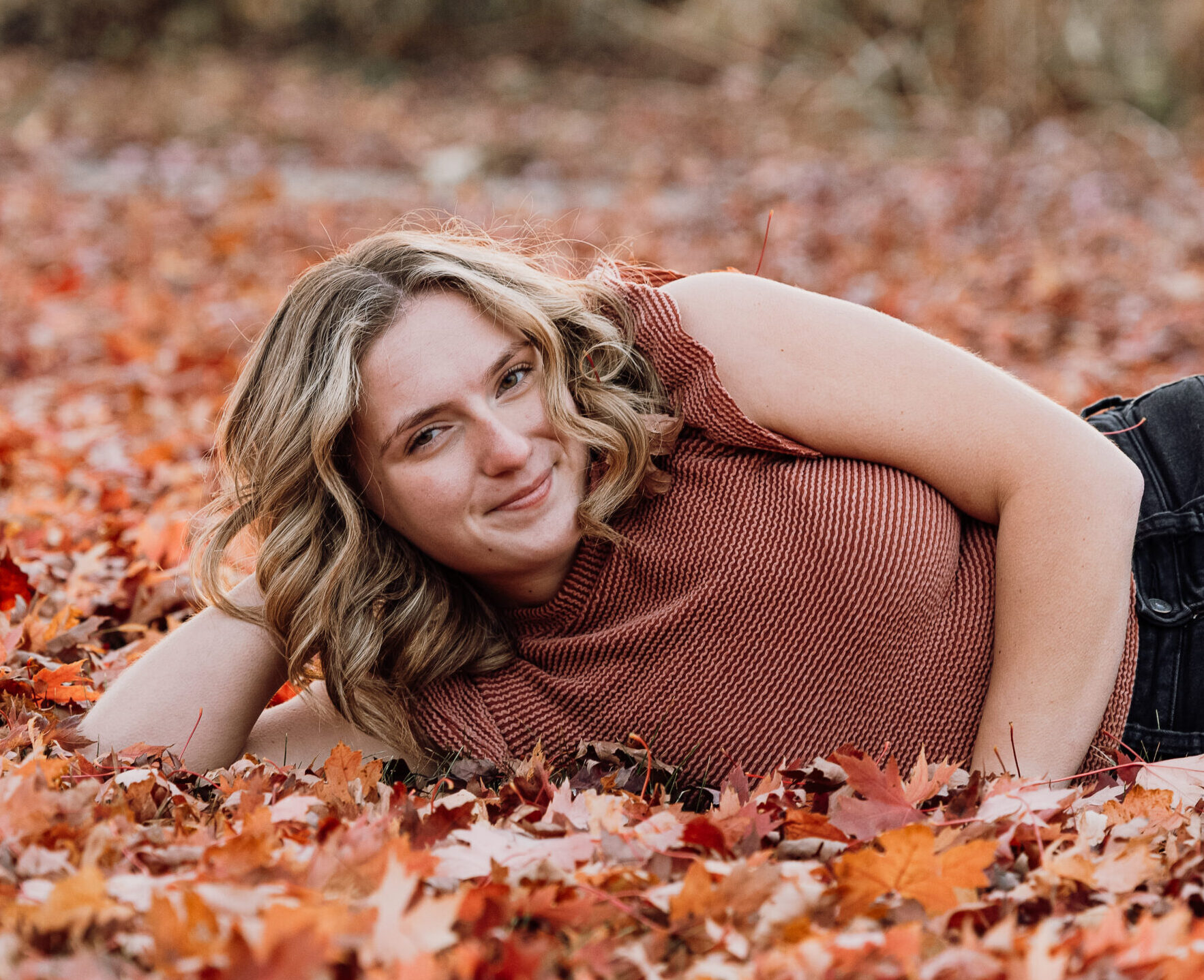 Close up of Trinity Baker laying in leaves