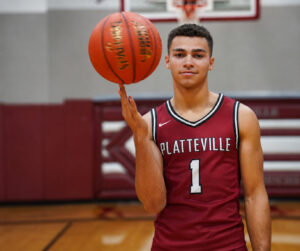 Myron Reuter in Platteville High School uniform with basketball